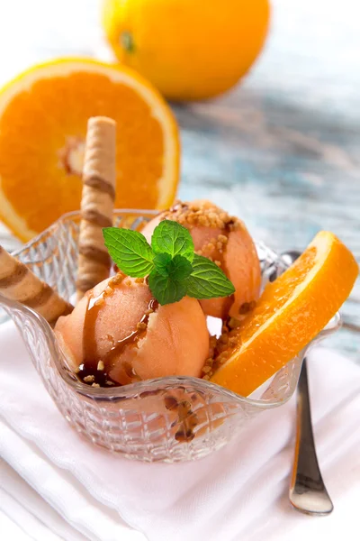 Ice cream scoops on wooden table — Stock Photo, Image