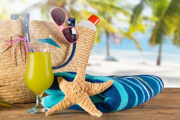 Close-up of summer accessories on sandy beach. — Stock Photo, Image