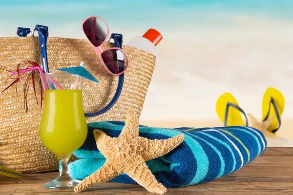 Close-up of summer accessories on sandy beach. — Stock Photo, Image