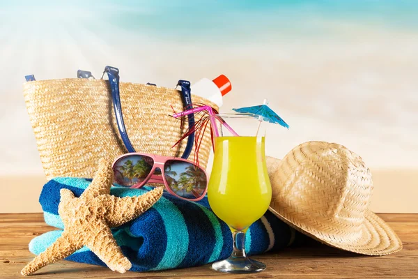 Close-up of summer accessories on sandy beach. — Stock Photo, Image