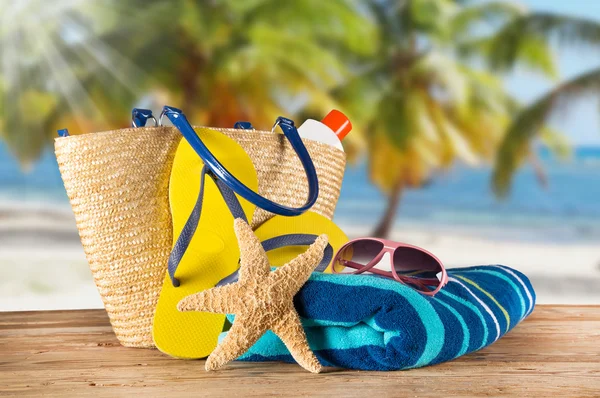 Close-up of summer accessories on sandy beach. — Stock Photo, Image