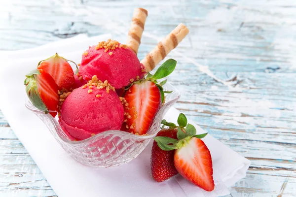 Tasty ice cream scoops on wooden table. — Stock Photo, Image