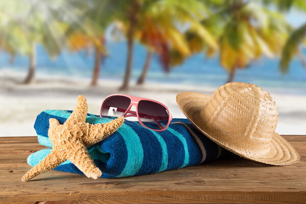 Summer accessories on sandy beach