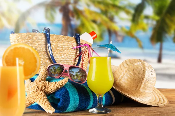 Summer accessories on sandy beach — Stock Photo, Image