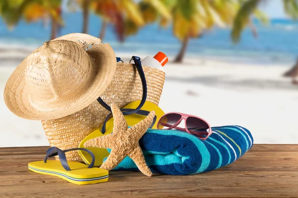 Summer accessories on sandy beach — Stock Photo, Image