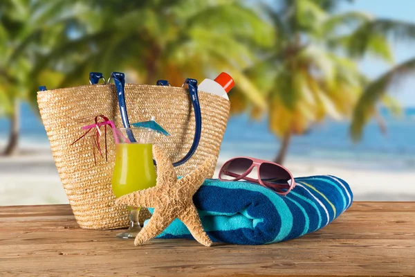 Summer accessories on sandy beach — Stock Photo, Image