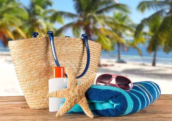 Summer accessories on sandy beach — Stock Photo, Image