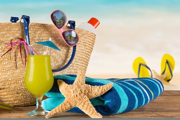 Summer accessories on sandy beach — Stock Photo, Image