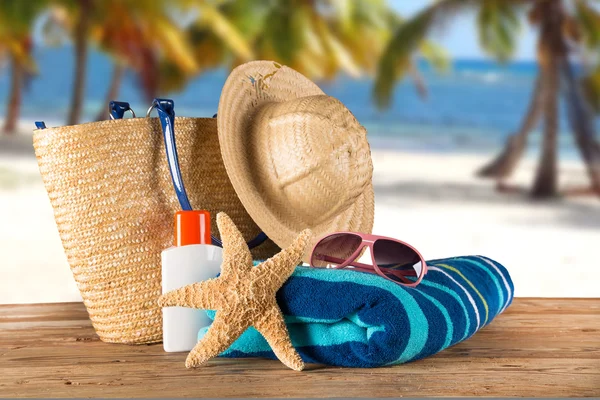 Summer accessories on sandy beach — Stock Photo, Image