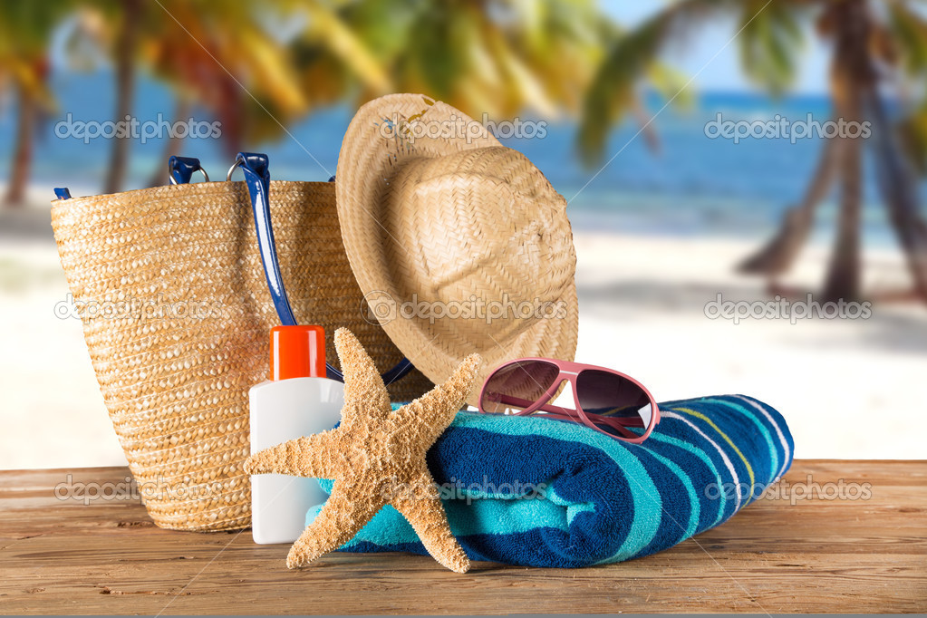 Summer accessories on sandy beach