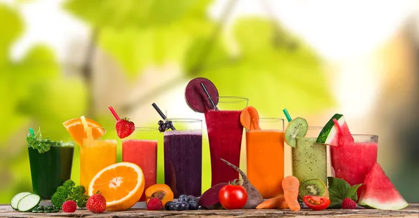 Fresh fruit juices on wooden table Stock Photo by Kesu01 49655803