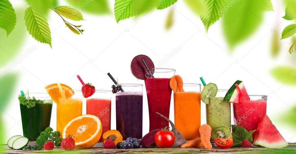 Fresh fruit juices on wooden table