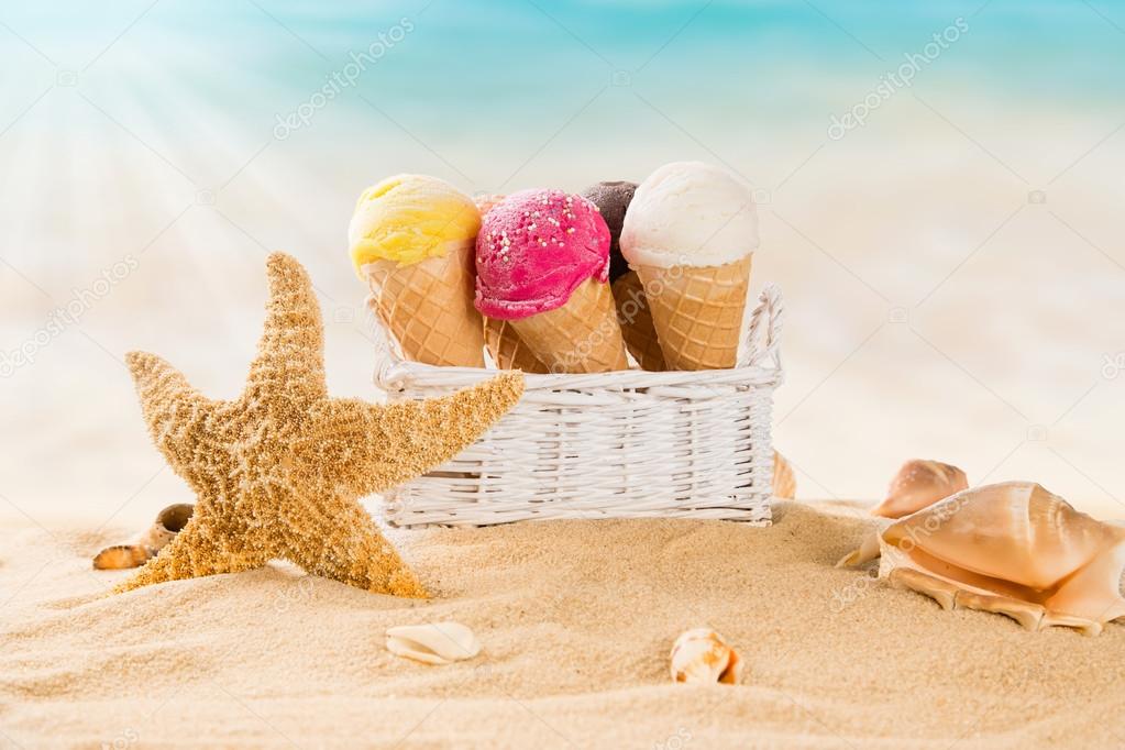 Tasty ice creams on sandy beach