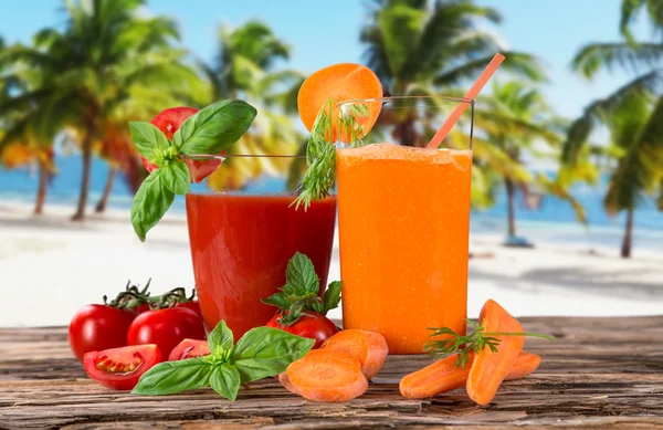 Fresh fruit juices on wooden table — Stock Photo, Image