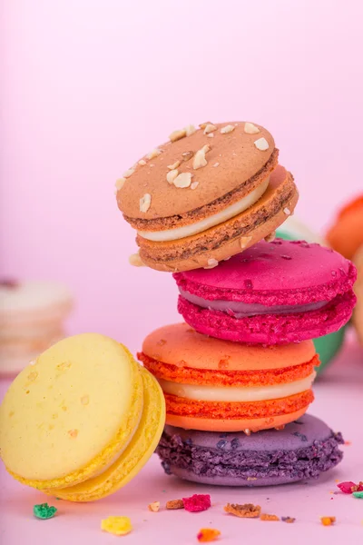 Colored macaroons on wooden table — Stock Photo, Image