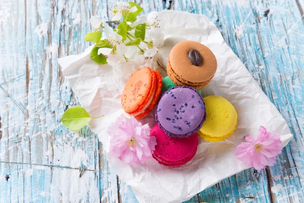 Colored macaroons on wooden table — Stock Photo, Image