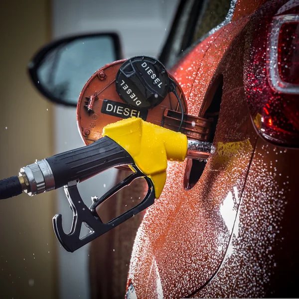 Gasoline dispenser in the car. — Stock Photo, Image