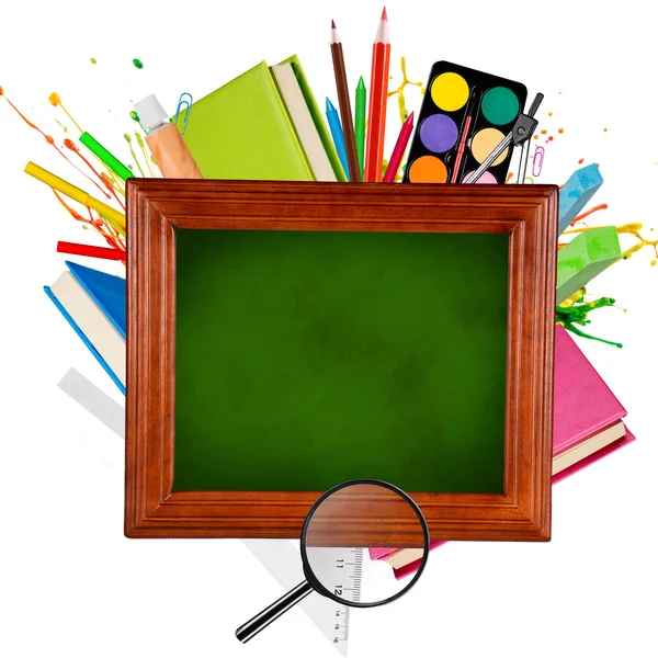 Wooden blackboard with school supplies — Stock Photo, Image