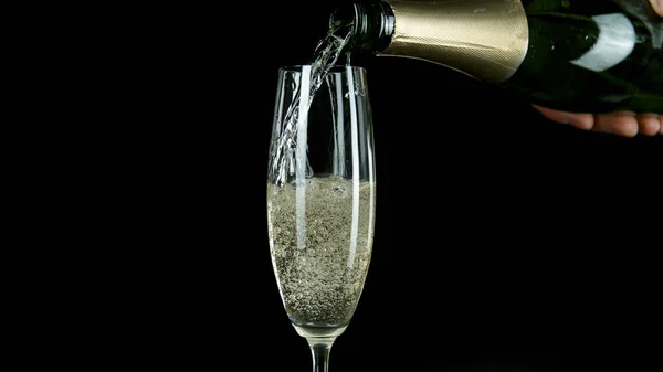 Freeze motion of pouring champagne into flute. — Stock Photo, Image