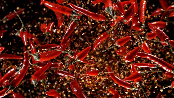 Freeze Motion Shot of Rotating Red Peppers. — Fotografia de Stock