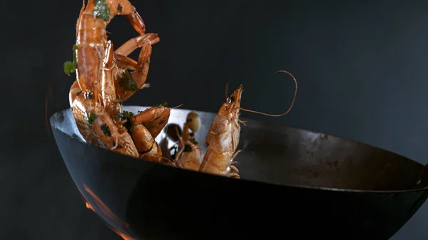 Freeze Motion of Wok Pan and Flying Ingredients in the Air. — Stock Photo, Image