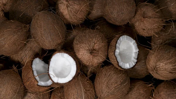 Cracked coconuts falling, freeze motion — Stock Photo, Image