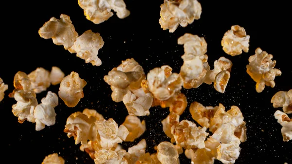 Falling Popcorn on Black Background. — Fotografia de Stock