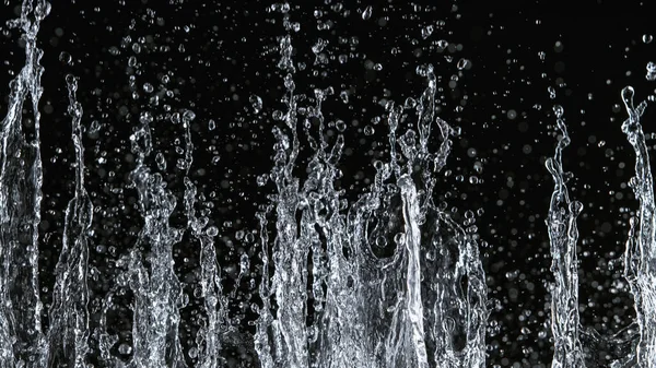 Freeze motion of water splash on black background — стоковое фото