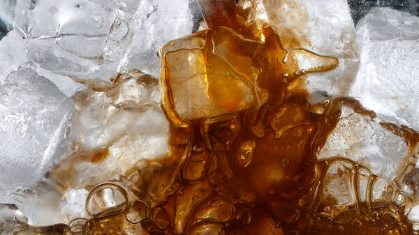 Super Slow Motion Shot of Pouring Coffee into Glass with Ice Cubes Stock Picture