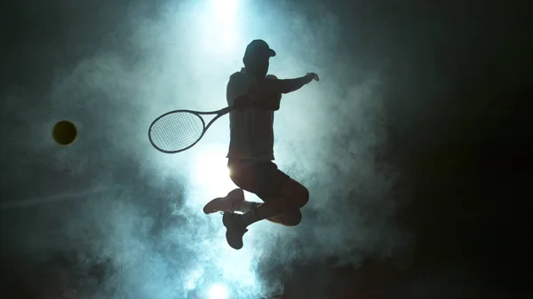 Jumping Player Hitting Tennis Ball Atmosferic Smoke Background — Stock Photo, Image