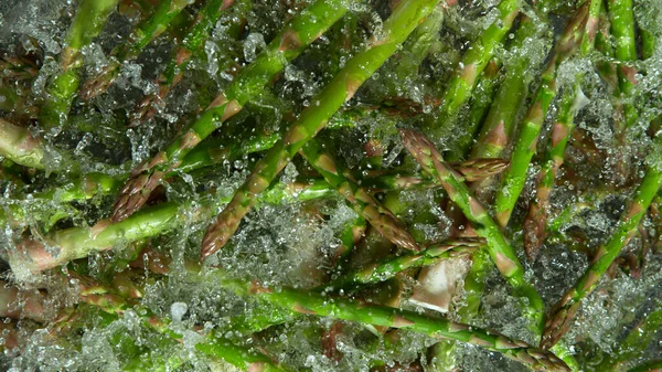 Freeze Motion Shot Splashing Fresh Asparagus Filmed High Speed Cinematic — Stock Photo, Image