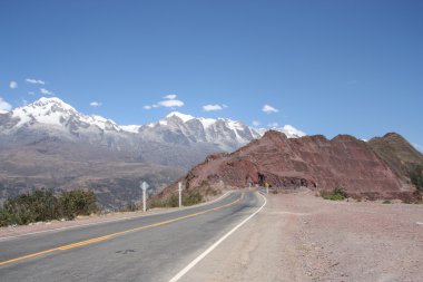 Mountain road stretches into the distance clipart