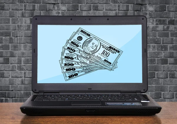 Laptop mit Dollar — Stockfoto