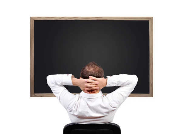 Man looking on blackboard — Stock Photo, Image