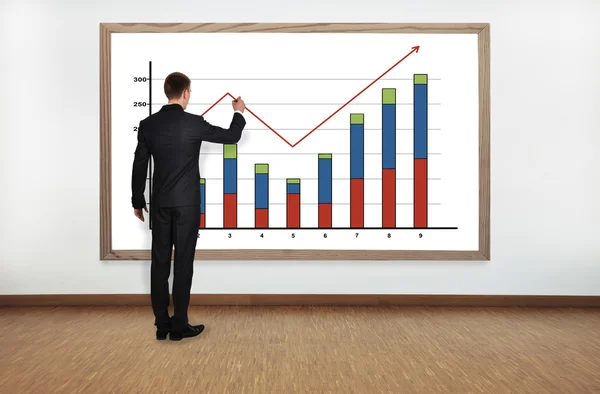Businessman drawing graph — Stock Photo, Image