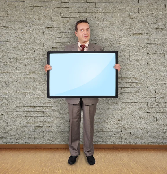 Hombre sosteniendo plasma — Foto de Stock