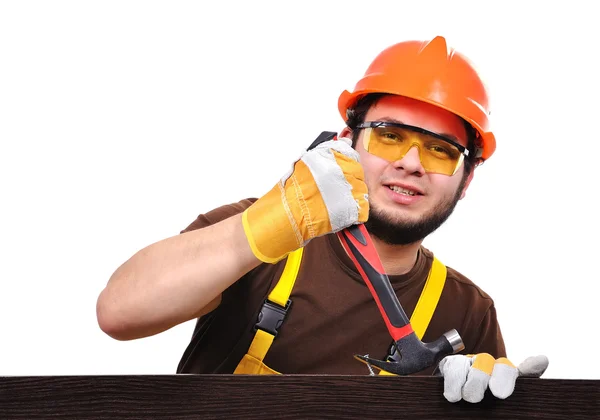 Bauunternehmer zieht einen Nagel — Stockfoto