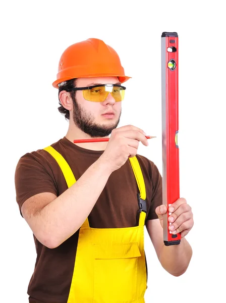 Construtor segurando wasserwaage e lápis — Fotografia de Stock