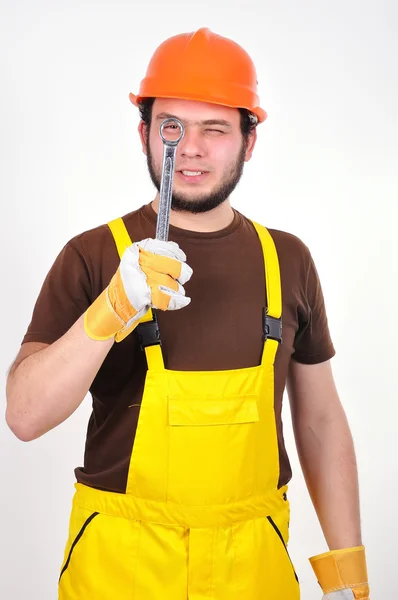 Builder holding wrench — Stock Photo, Image