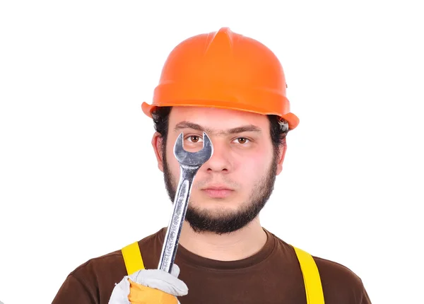 Builder holding wrench — Stock Photo, Image