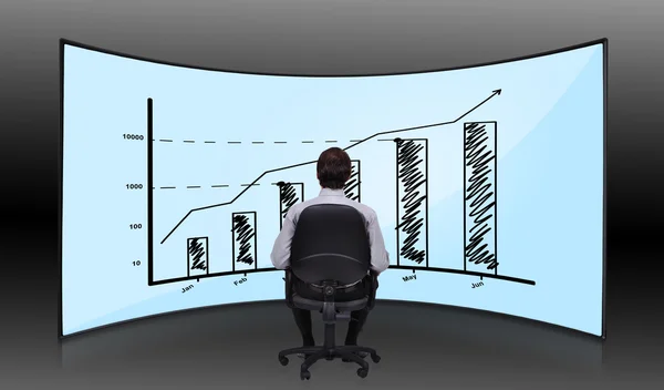 Empresario mirando el gráfico — Foto de Stock