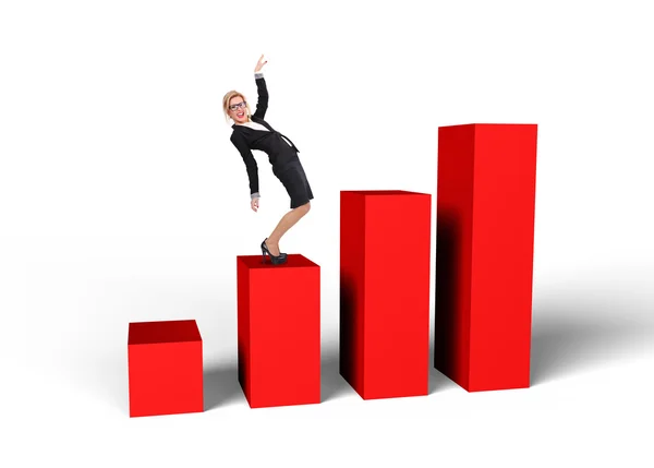 Businesswoman standing on graph — Stock Photo, Image