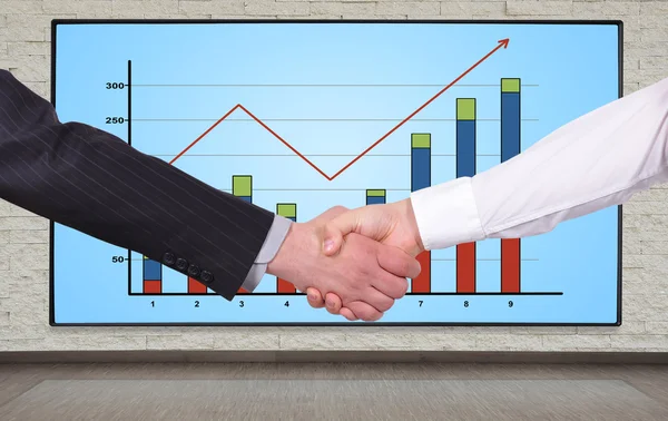 Handshake and chart — Stock Photo, Image