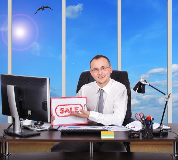 Man holding clipboard with sale — Stock Photo, Image