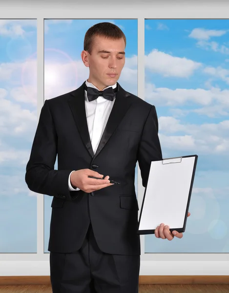 Businessman  holding clipboard — Stock Photo, Image