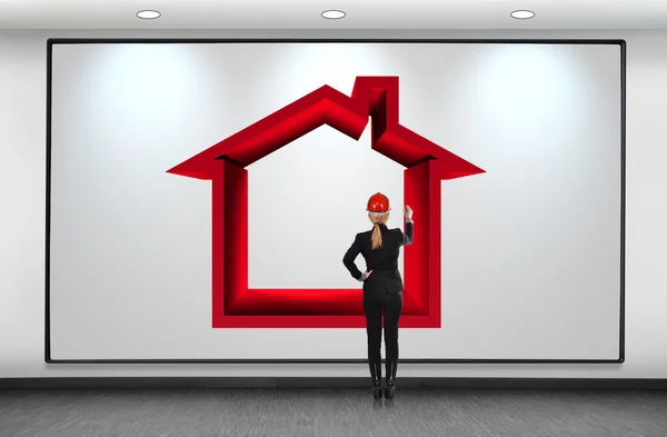 Mujer dibujo casa roja — Foto de Stock