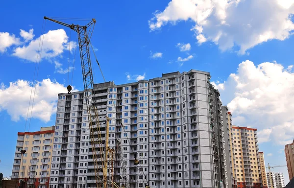 Crane and unfinished buildings — Stock Photo, Image