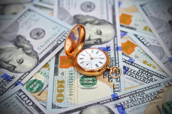 Money and antique watch — Stockfoto