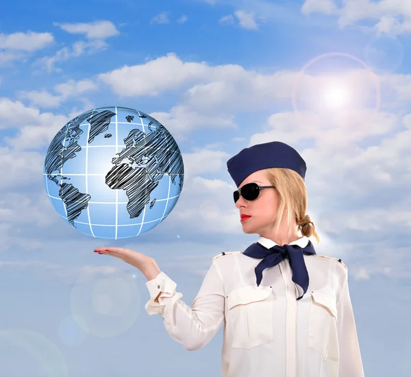 Stewardess holding earth — Stock Photo, Image