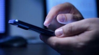 Businessman Using Smart Phone With Spreadsheet Reports. Business, Financial And Analyzing Concept. Close Up